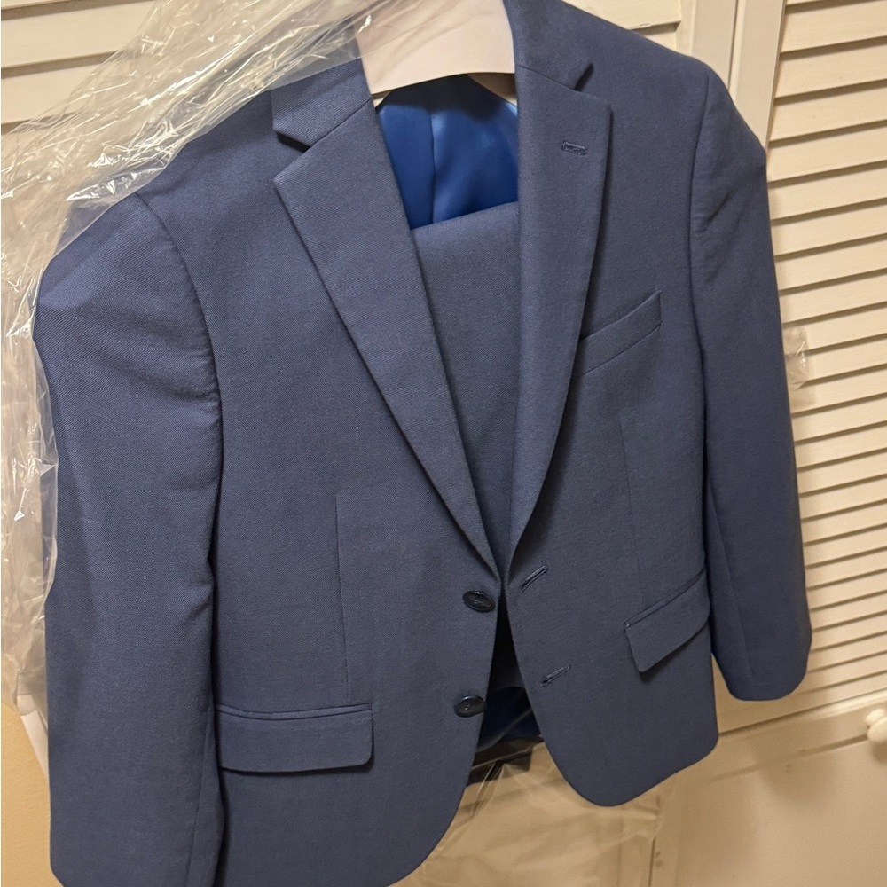 Handsome suit for young boy. Worn once at a wedding.